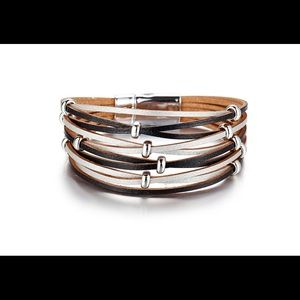 Leather style bracelet with magnetic closure.